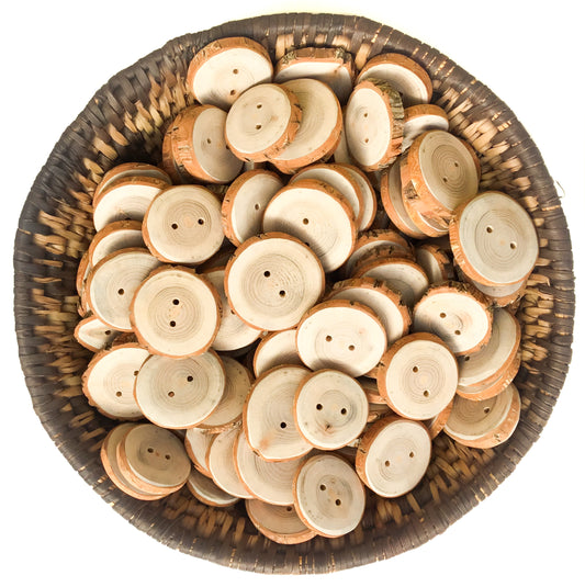 A basket filled with round, two-hole wooden buttons made from sassafras wood.